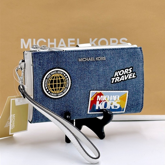 Michael Kors Handbags - MICHAEL KORS Jet Set Travel Large Embellished Denim Wristlet COLOR DENIM